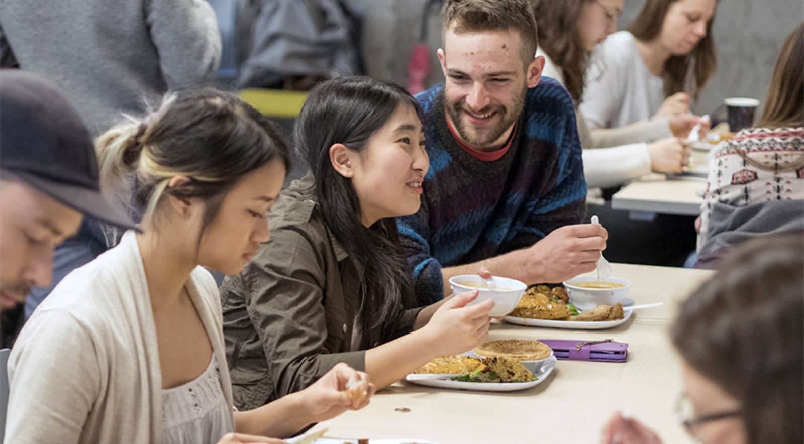 Students eat a recovered food meal Students eat recovered food meal